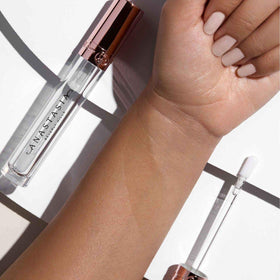 Anastasia Beverly Hills Crystal Gloss captures light with bright reflection on lips