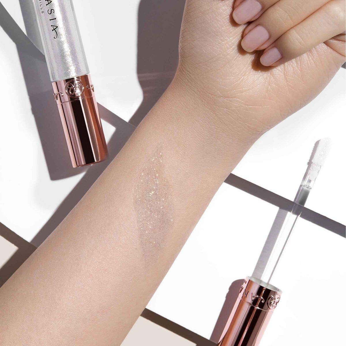 Anastasia Beverly Hills Honey Diamond Gloss on lips for radiant non-sticky comfort.
