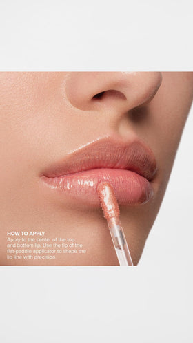 Anastasia Beverly Hills Peachy lip gloss layered over lipstick for dimension