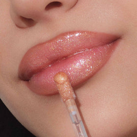 Anastasia Beverly Hills Lip Gloss Pink Ginger close-up showing soft glow and smooth texture.