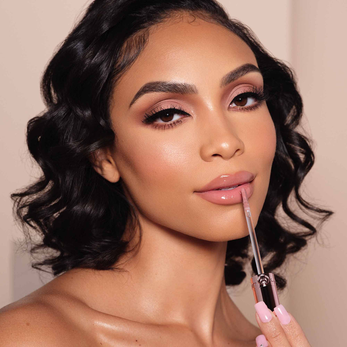 Close view of glossy lips wearing Anastasia Beverly Hills Lip Gloss Sun Baked