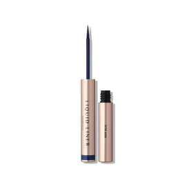 Anastasia Beverly Hills navy blue liquid eyeliner bottle closeup showing rich pigment for precise lines.