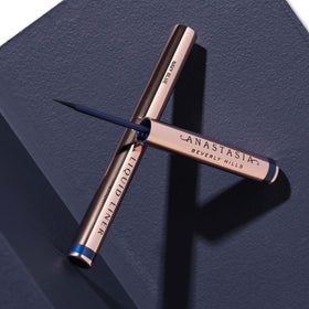 Anastasia Beverly Hills navy blue eyeliner on the eye for a dramatic dusk look.