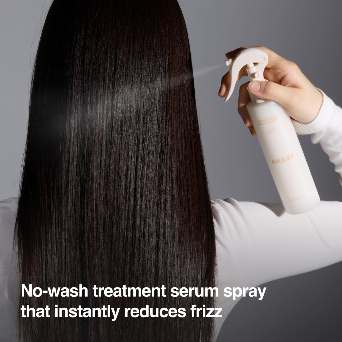 ANAZE Leave-In Collagen Serum spray application on frizzy hair for smoother strands.