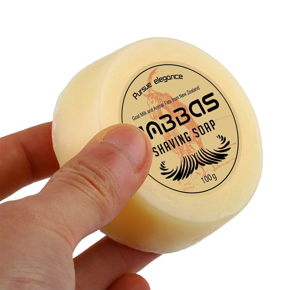 Anbbas goat milk shaving soap close-up shows creamy texture for gentle beard care.