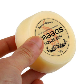 Anbbas goat milk shaving soap close-up shows creamy texture for gentle beard care.