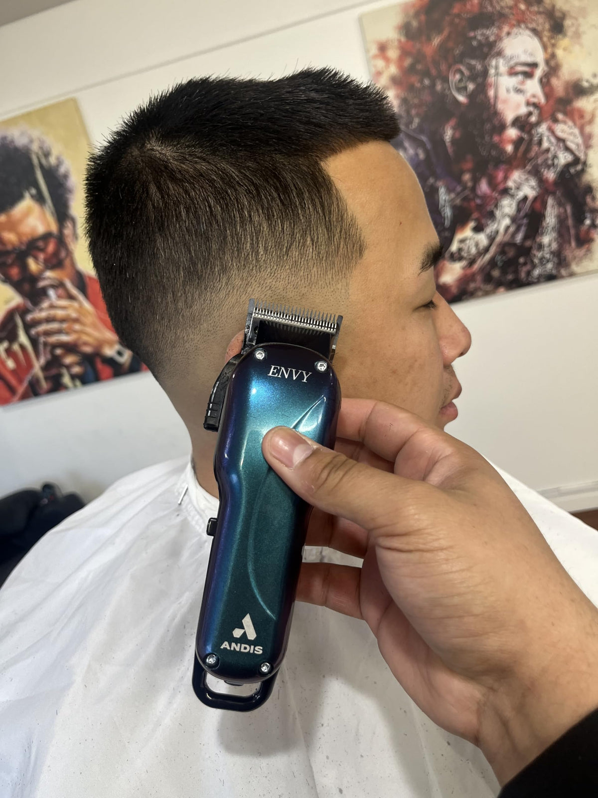 Andis Galaxy Envy clipper on charging dock ready to power up