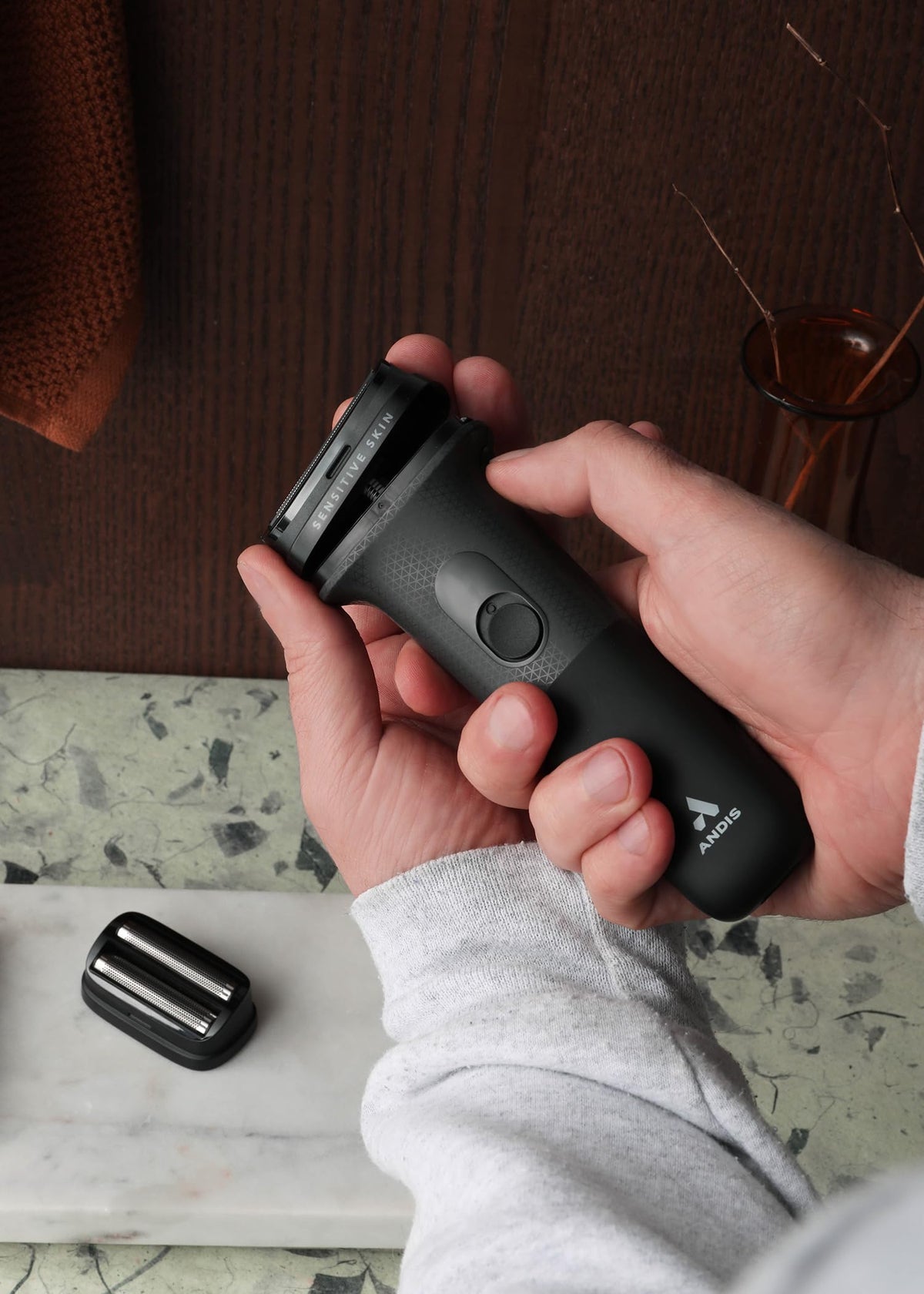 Andis inFORM travel-friendly design demonstrates compact, on-the-go shaving.