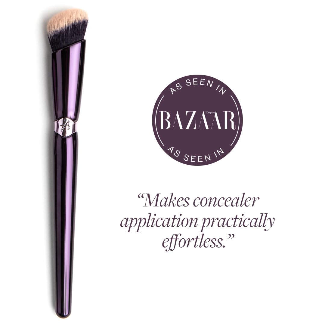 ANISA BEAUTY angled concealer brush in hand demonstrates controlled application around eyes.