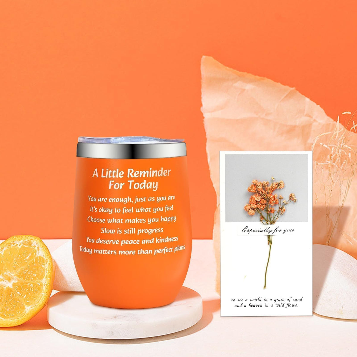 ANOTION orange self-care cup within the set for cozy beverages.