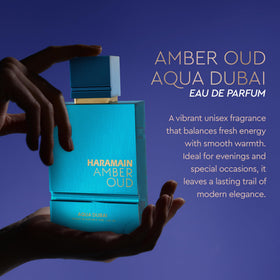 Aqua Dubai Amber Oud heart-notes bottle detail highlighting tropical fruit richness.