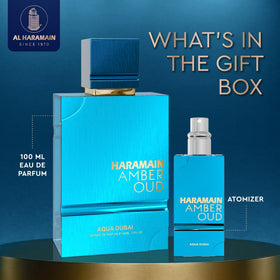 Aqua Dubai Amber Oud top-notes bottle close-up for a fresh daytime vibe.