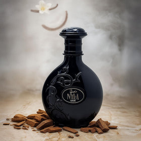 ARABIYAT Nyla Suede bottle label emphasizes refined branding for connoisseurs