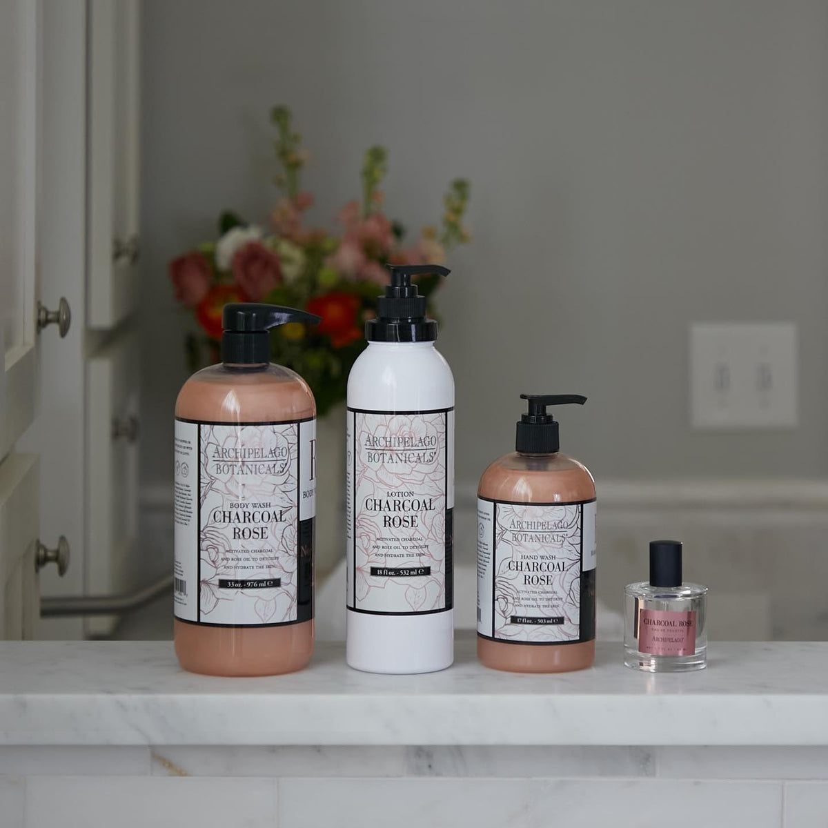 Archipelago Botanicals Charcoal Rose ingredients-closeup spotlights activated charcoal and rose oil benefits.