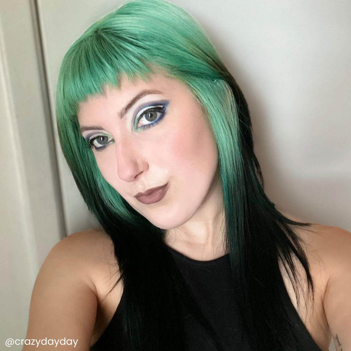Arctic Fox Pistachio Macaron on a hair strand, bright mint shade swatch.