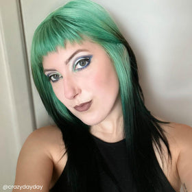 Arctic Fox Pistachio Macaron on a hair strand, bright mint shade swatch.