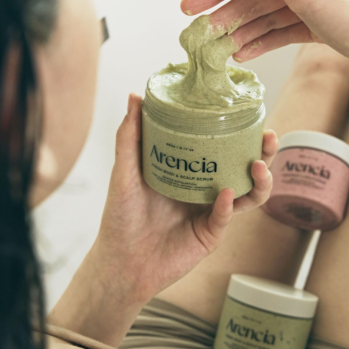 Arencia Fresh Cloud Sea Salt Scrub on a bathroom shelf for daily ritual.