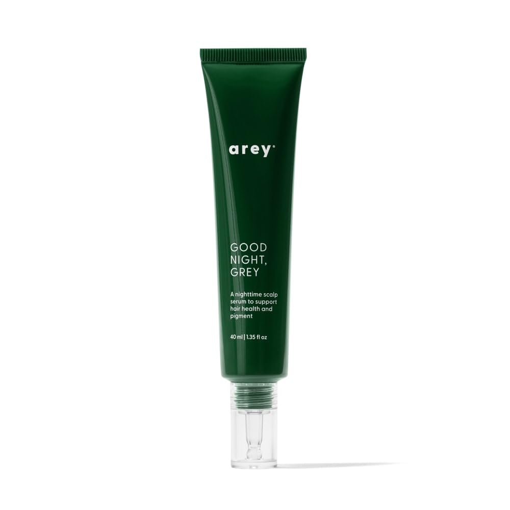 Arey Good Night Grey overnight scalp serum bottle on dresser supports color-safe nighttime care.