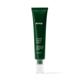Arey Good Night Grey overnight scalp serum bottle on dresser supports color-safe nighttime care.