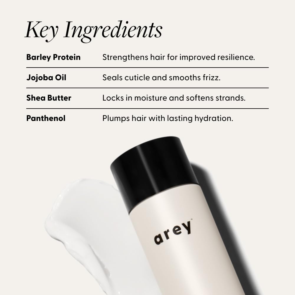 Arey Smooth Conditioner creamy texture close-up for frizz control and shine.