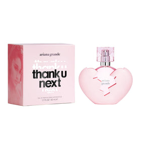 A Ariana Grande Thank U Next bottle cap detail, shiny pink accent for premium fragrance experience.