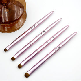 Aridito pink metal French-tip brush designed for accurate nail tip cleaning.