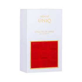 Armaf Uniq bottle with vanilla and caramel hues in soft lighting.
