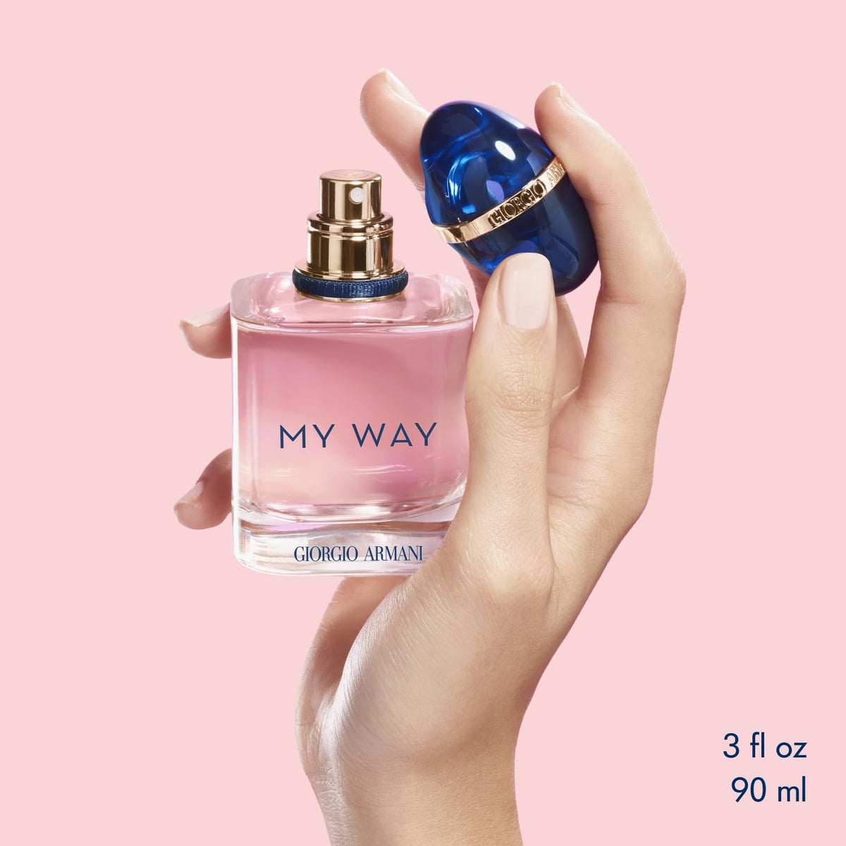 Armani Beauty My Way bottle base shows cedarwood and vanilla tones.