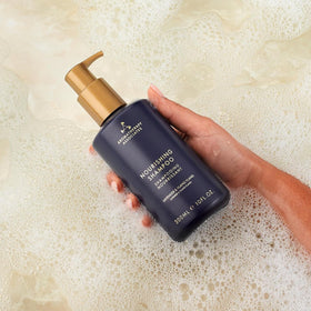 Aromatherapy Associates Balance Shampoo sustainable packaging close-up with post-consumer materials.