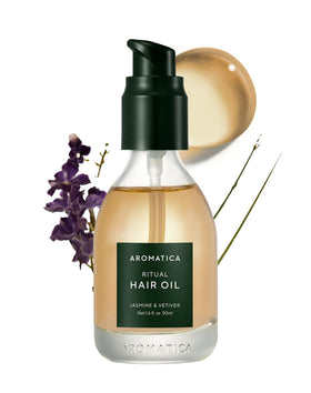 AROMATICA Ritual Jasmine & Vetiver Hair Oil bottle pour for smooth, radiant strands.