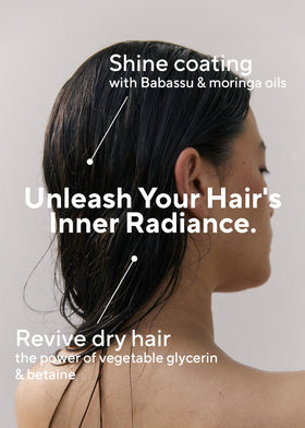 AROMATICA Rosemary Conditioner being poured for detangling and smoothing.