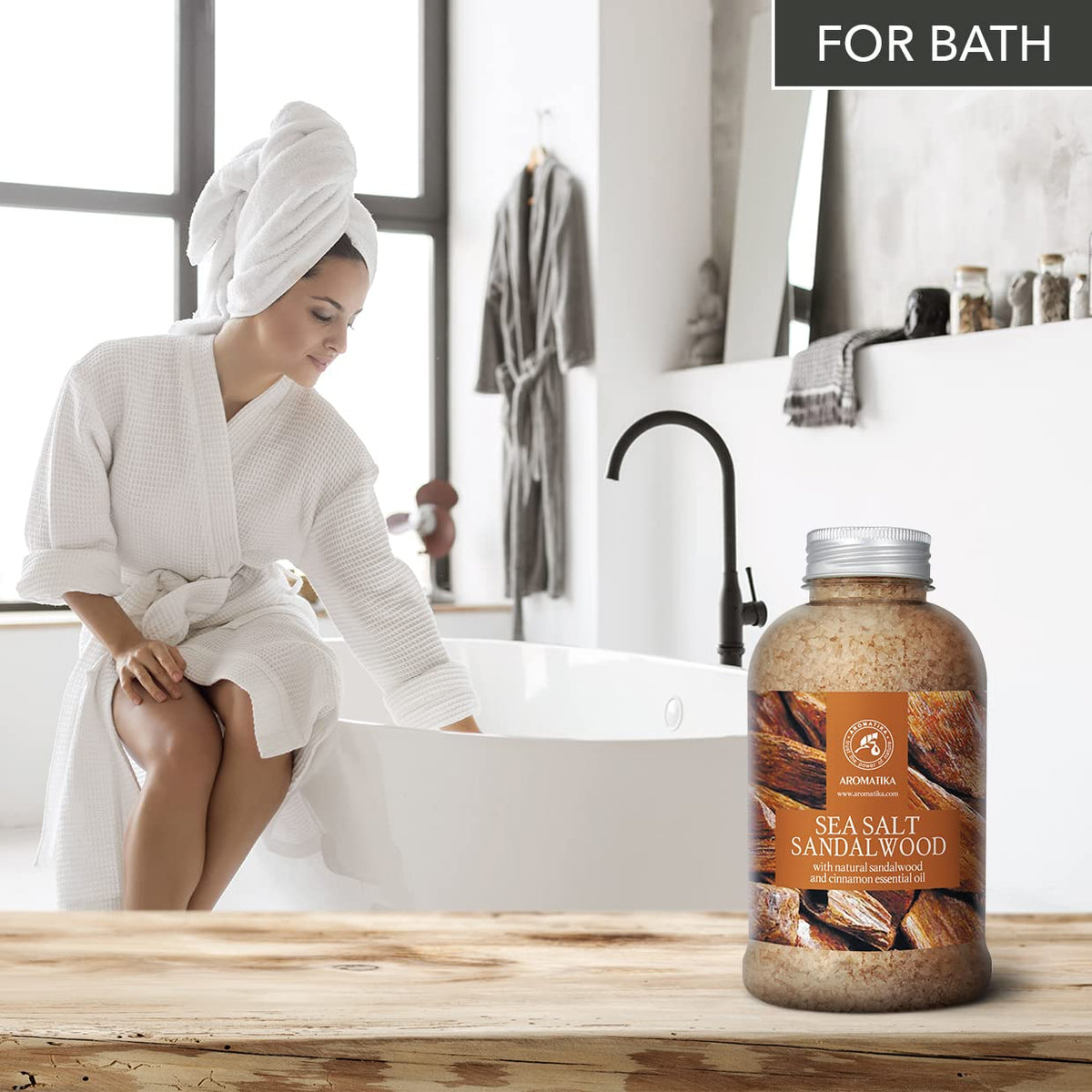 AROMATIKA sandalwood cinnamon oil drops illustrate the aromatic blend for unwinding.