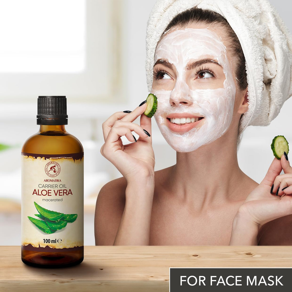 AROMATIKA Burdock Root Oil beside skincare products, highlighting versatile use.