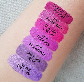 Aromi Fab Flamingo close-up lip shine showcasing shimmering magenta detail.