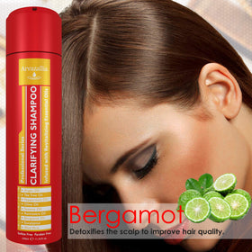 Arvazallia Clarifying Shampoo in hand ready for cleansing routine.