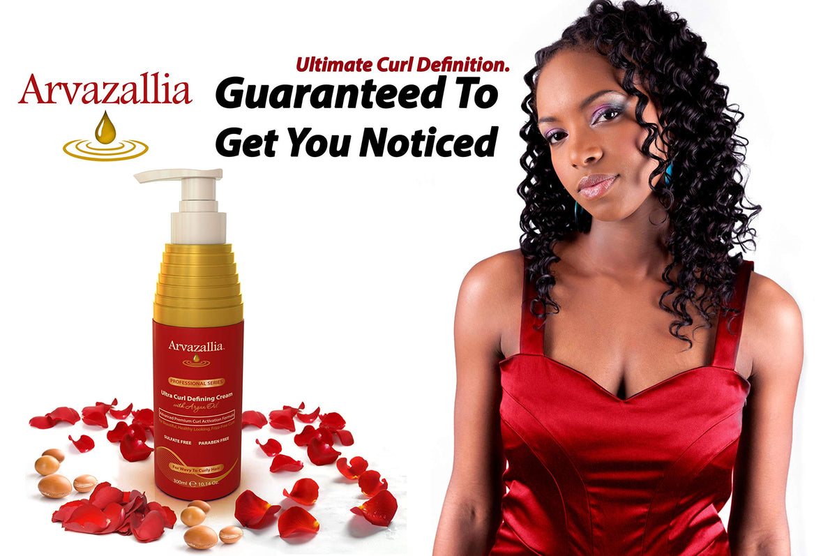 Hands apply Arvazallia curl cream to damp hair for curl activation.