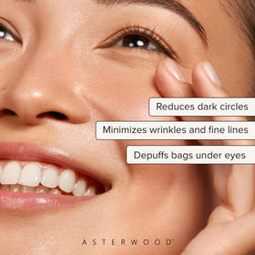Asterwood under-eye application showing gentle pressure for puffiness reduction