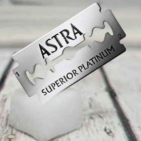 Platinum-coated stainless steel blade detail conveys premium durability and smooth gliding.
