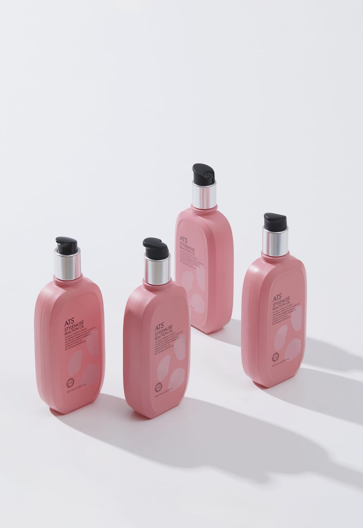 ATS Stylemuse Reaction Oil on damp hair showing even distribution