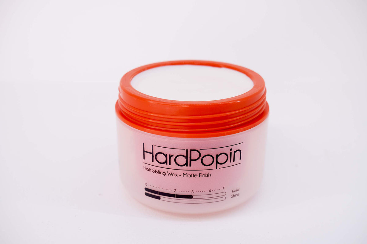 ATS Stylemuse Hard Popin Wax on a woman hair for versatile styling.