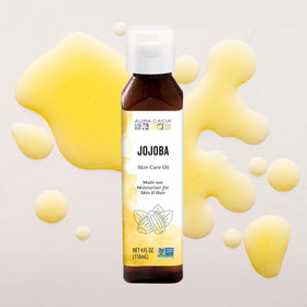 Aura Cacia Balancing Jojoba Oil applied to dry skin