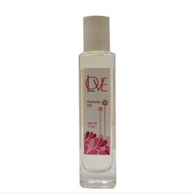 Auric Blends Love Perfume Oil bottle on right, inviting daily wear with a warm aroma.
