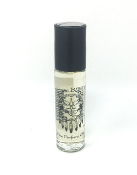 Hand applying Auric Blends Sandalwood Roll-On to pulse point