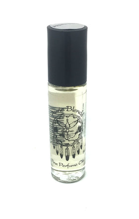 Travel-ready Auric Blends Sandalwood Roll-On in small glass bottle