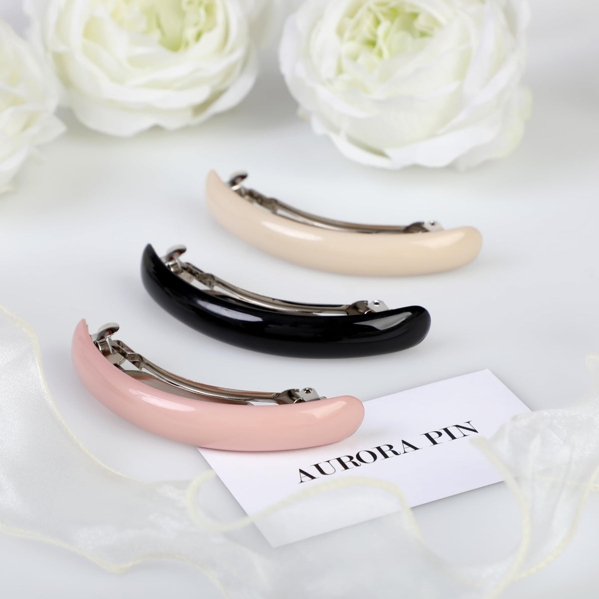 Aurora Pin tortoise-shell clip on hair demonstrates secure hold for thick hair.