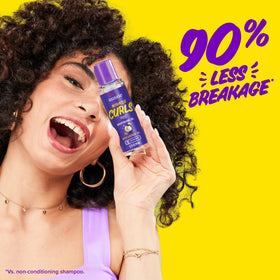 Aussie Miracle Moist frizz control for textured curls and waves.