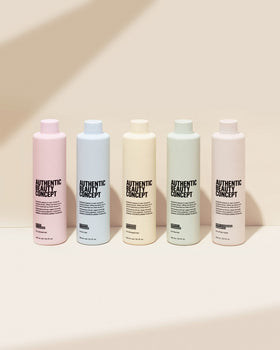 Close-up of Amplify Cleanser bottle showing sulfate-free cleansing action