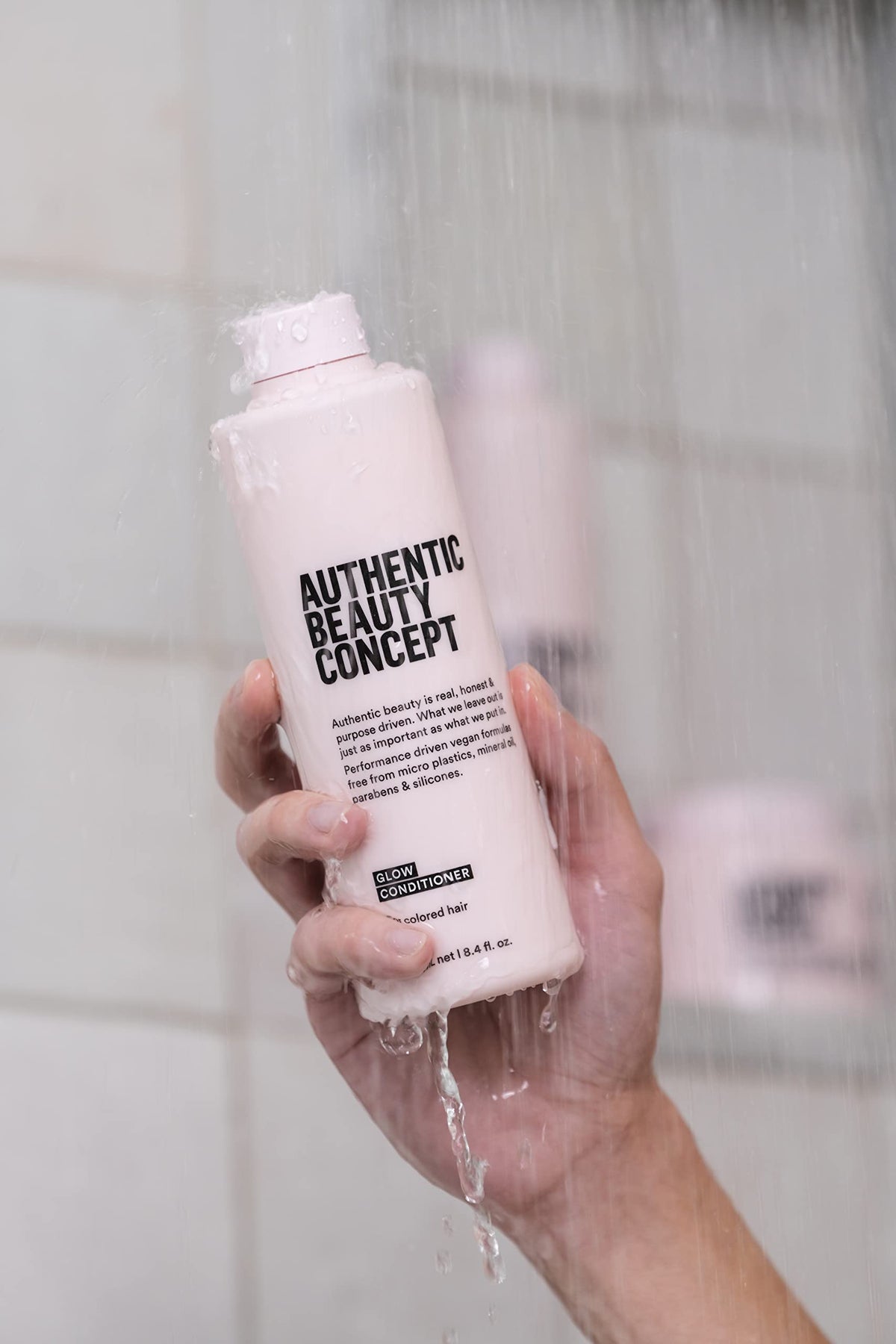 Authentic Beauty Concept Glow Conditioner texture closeup highlights light-weight formula.