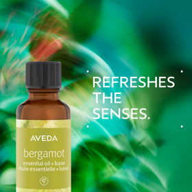 Close-up of Aveda Bergamot Essential Oil + Base bottle highlighting vibrant citrus notes.