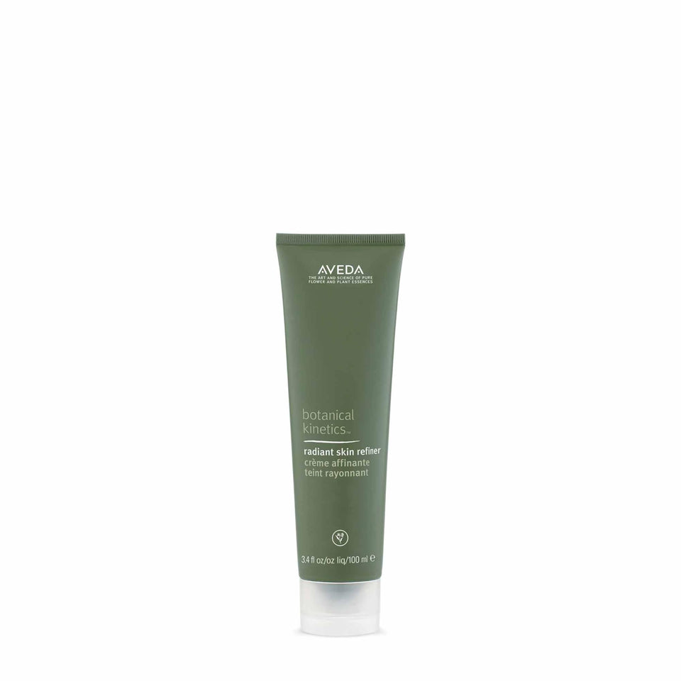 Aveda Radiant Skin Refiner jar showing creamy exfoliating texture for smoother skin.